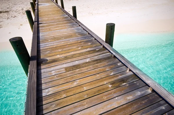 Jetty to a tropical beach — Stock Photo, Image