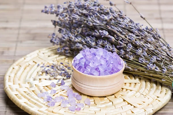 Aromatic bath salt and dry lavender flowers — Stock Photo, Image