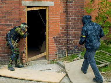 Military Style Airsoft Men Attacking Doorway clipart