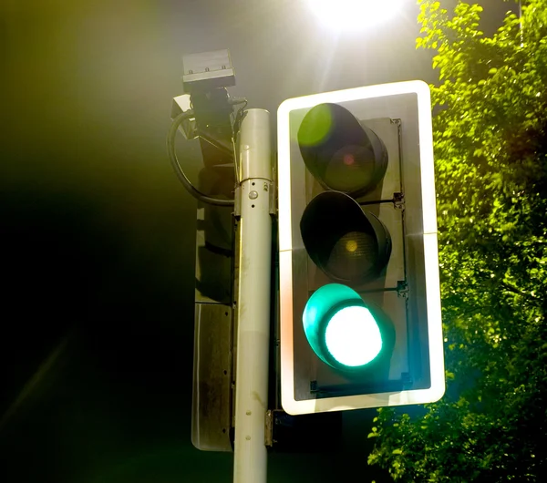 stock image Traffic Lights Green Go near a Bright Lamp