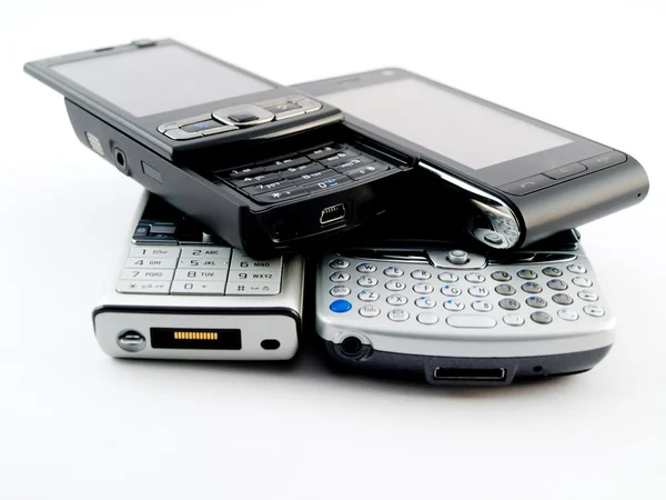 Patru telefoane mobile moderne PDA Smartphone — Fotografie, imagine de stoc
