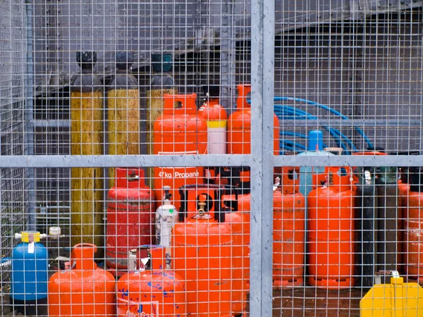 Secured Gas Canisters in Fenced Area — Stock Photo, Image