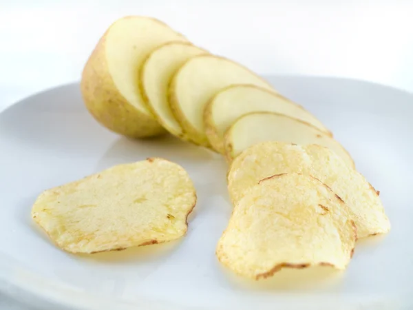 stock image Potato sliced into chips crisps