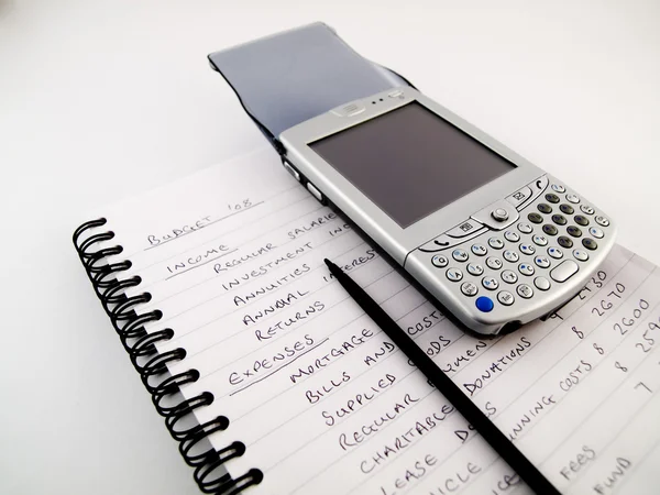 Смартфон PDA зі стилусом на домашньому бюджеті Стокова Картинка
