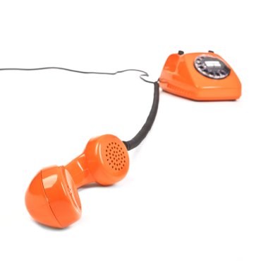 Classic dial phone on white background clipart