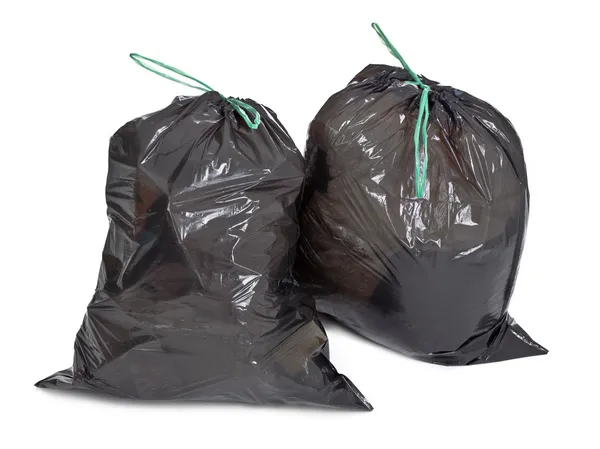 Два связанных мусорных мешка на белом — стоковое фото