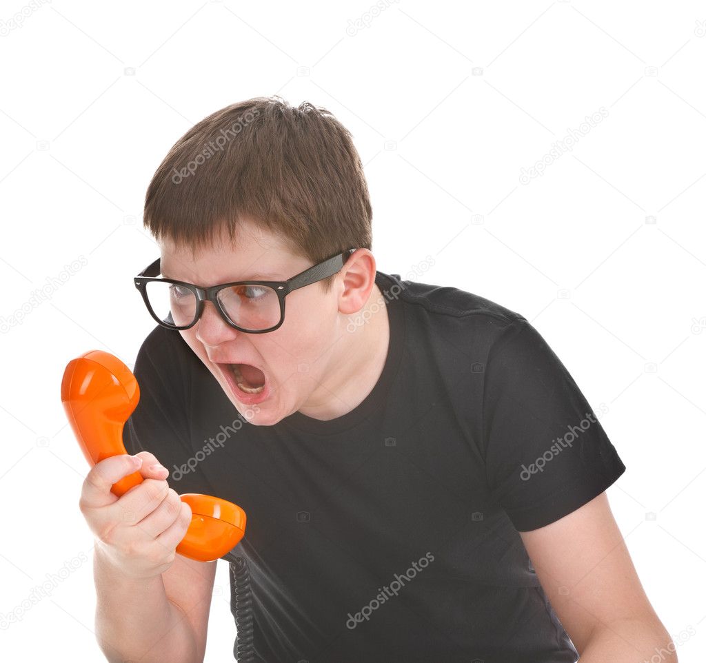 Angry kid screams into the telephone