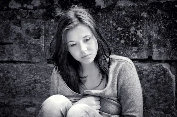 Teenage girl looking thoughtful about troubles — Stock Photo, Image
