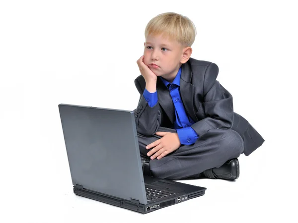 stock image Thoughtful boy with computer