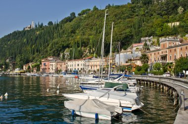 Yachts in small town on Garda Lake, Toscolano clipart