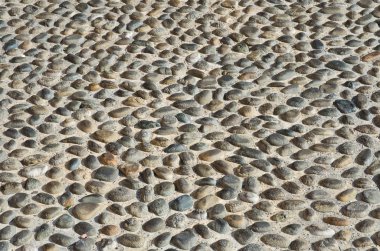 Textured cobbled wall background, stones and cement clipart