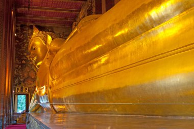 Lying Golden Buddha in Wat Pho, Bangkok clipart