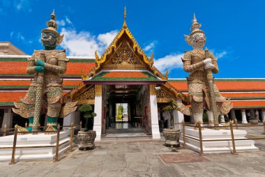 Thai demons standing in Grand palace, Bangkok clipart