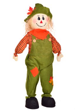 Fall Decoration Of A Stuffed Scarecrow For Thanksgiving Celebrations clipart