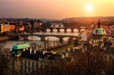Panoramic view on Charles bridge and sunset Prague lights. Bohemia, Czech R