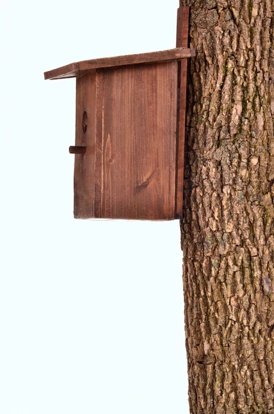 Wooden starling-house on a bole isolated on white — Stock Photo, Image