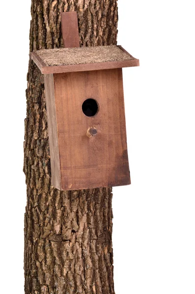 Handmade bird house (starling house) on a tree trunk isolated on white back — Stock Photo, Image