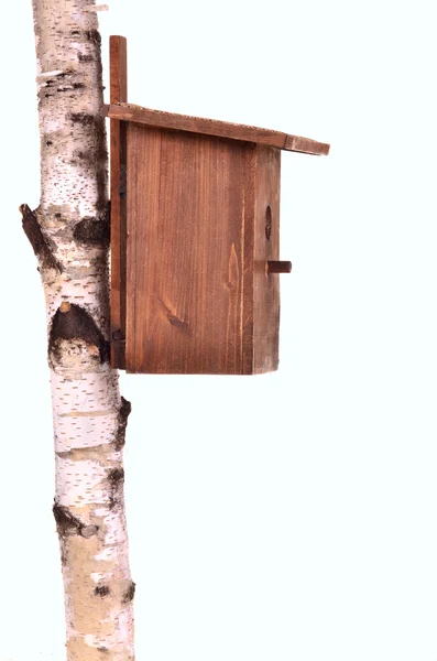 Brown starling-house on a birch trunk isolated — Stock Photo, Image