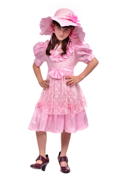 Allvarlig flicka klädd i rosa klänning och hatt — Stockfoto