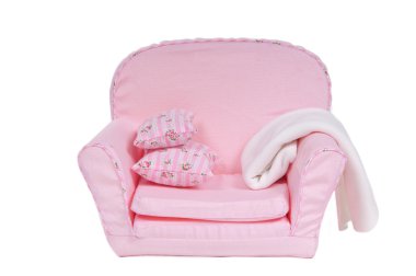 Comfi pink armchair with pillows and blanket on it isolated on white backgr clipart