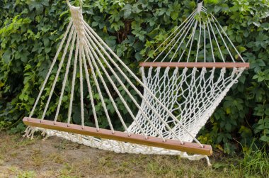 Hammock in the sunny yard clipart