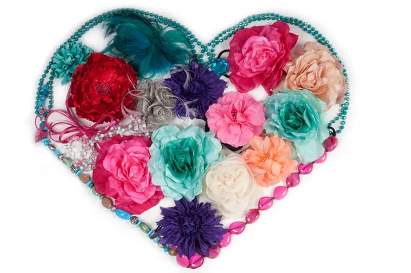 Flower heart made of ladies accessories (barrettes and beads) — Stock Photo, Image