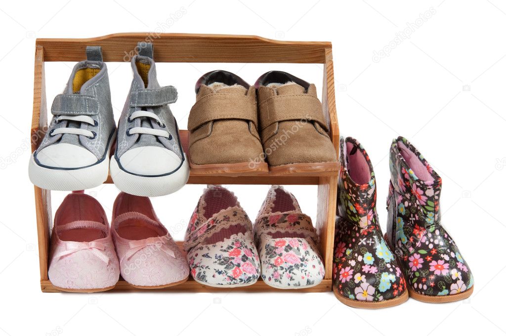 Shelf of children shoes for all occasions isolated on white background