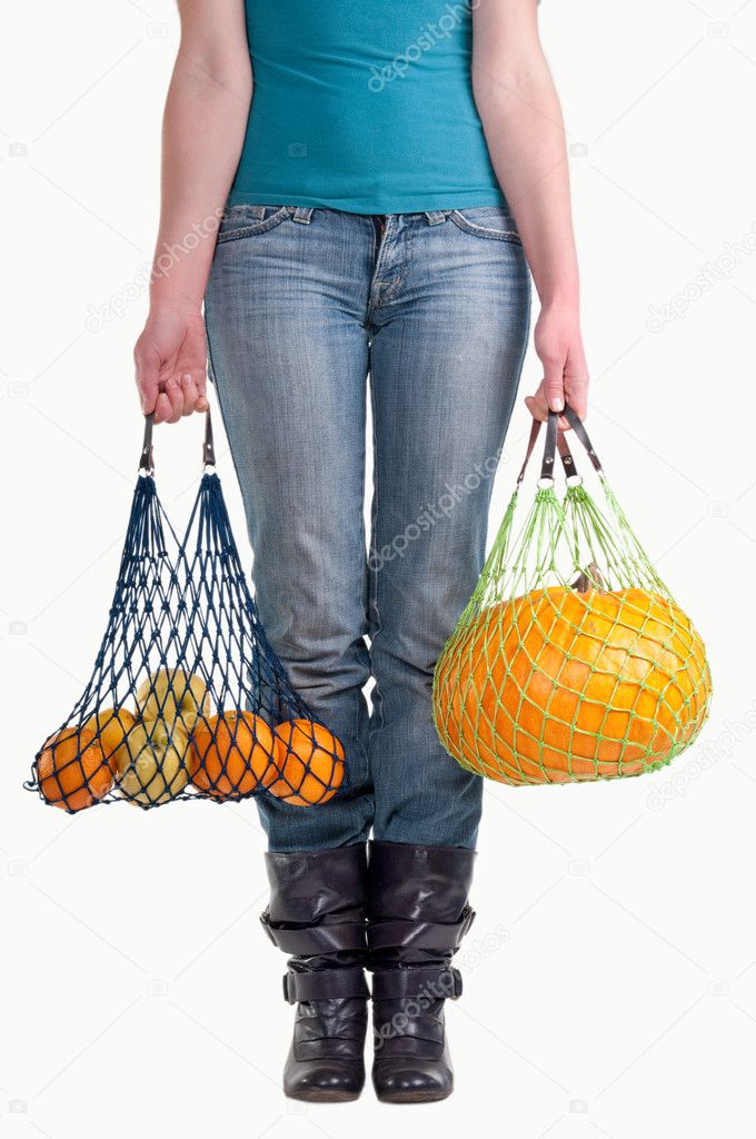 Woman with two fruit grocery bags