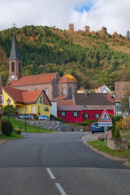 Road leading to typical French villiage clipart