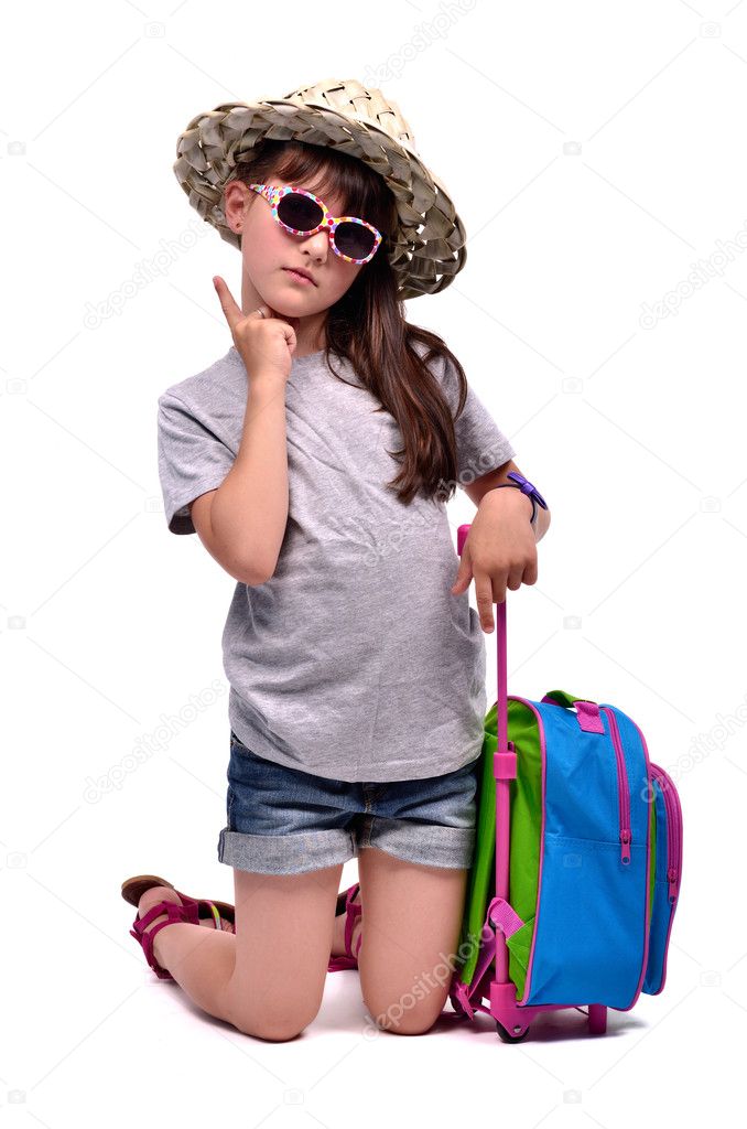 Little girl with travel bag with her finger up
