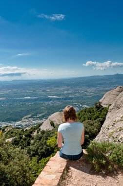 Woman sitting on the edge of a path clipart