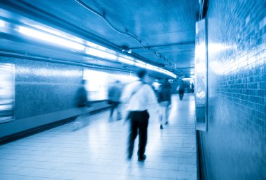 Passengers walking in underpass clipart