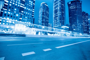 Light trails on the modern street in shanghai at night clipart