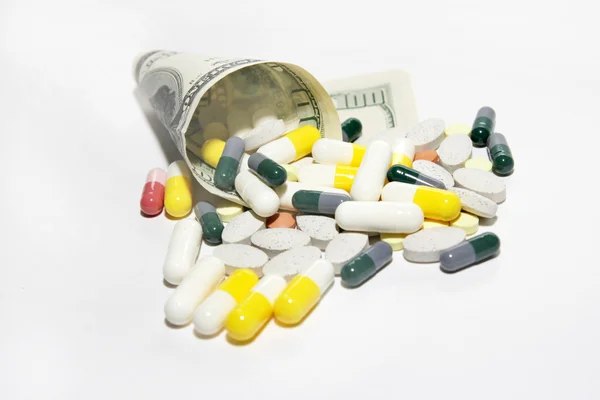 Léčivé přípravky a dolary — Stock fotografie
