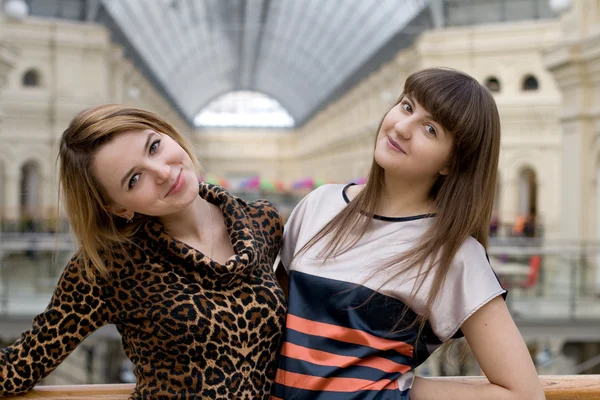 Two female friends walking in a shop — Stock Photo, Image