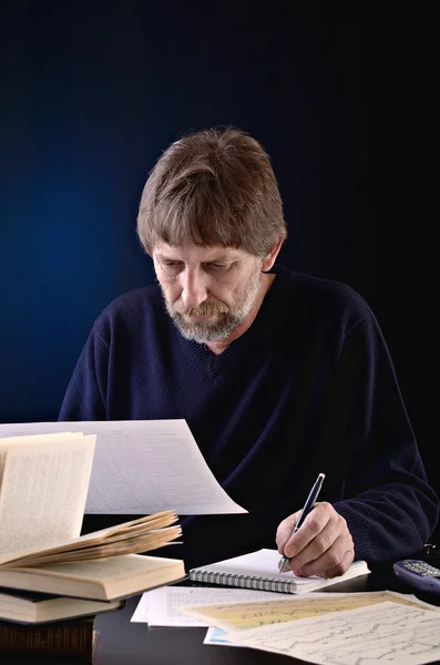 stock image Portrait of an elderly man at a desk