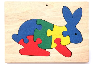 Colorful wooden puzzle in shape of rabbit clipart