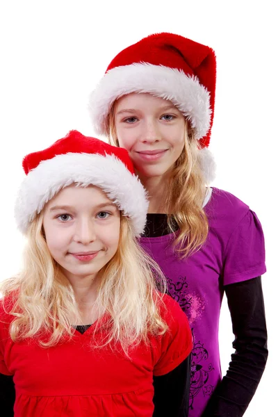 Duas meninas com chapéu de Natal — Fotografia de Stock