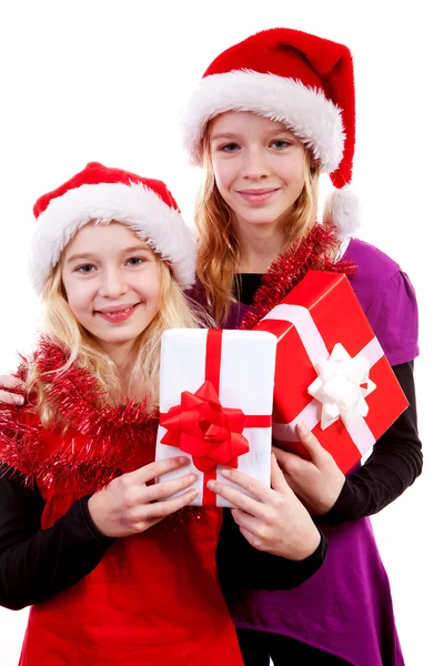 Two girl with christmas hat and presents — Stock Photo, Image