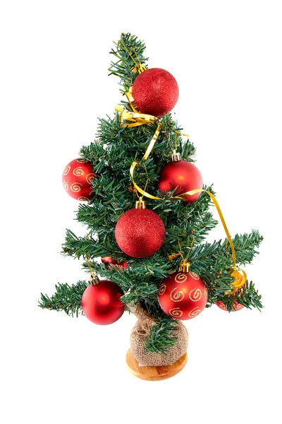 Plastic christmas tree withred balls — Stock Photo, Image