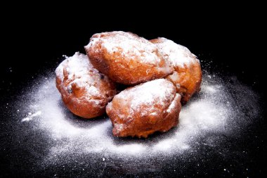 Pile of Dutch donut also known as oliebollen clipart