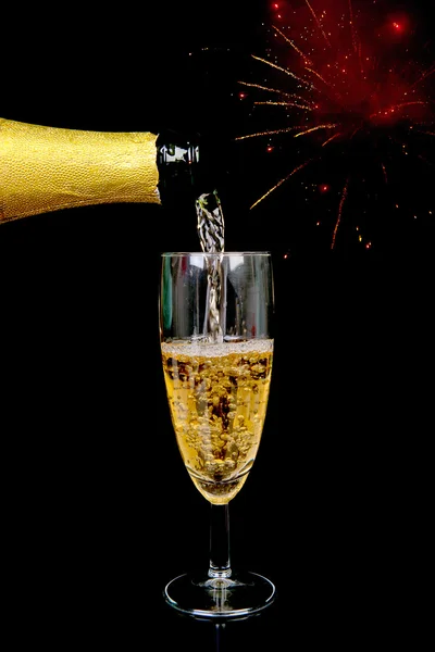 Pouring champagne on New year's Eve — Stock Photo, Image