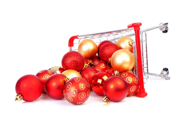 Faller kundvagn med julen bollar — Stockfoto
