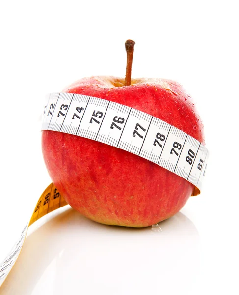 Healthy diet red apple with measure tape — Stock Photo, Image