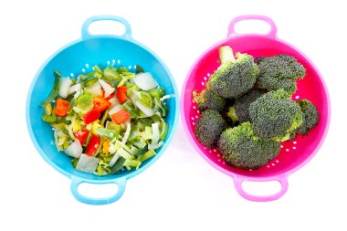 Two colorful colanders with vegetables clipart