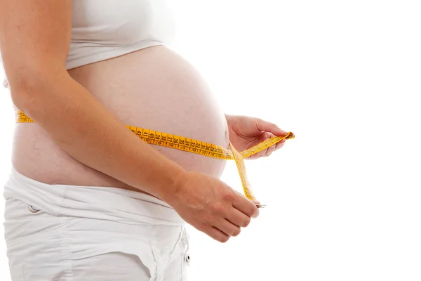 测量怀孕的肚子 — 图库照片