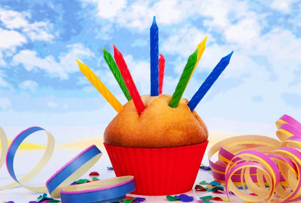 Cupcake with lots of candles and colorful confetti — Stock Photo, Image