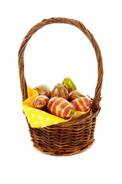 Cane basket with easter eggs — Stock Photo, Image