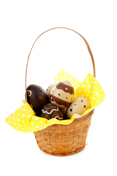 Cane basket with easter eggs — Stock Photo, Image