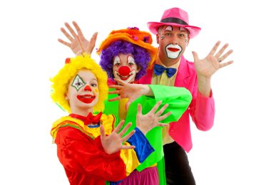 Three dressed up as colorful funny clowns